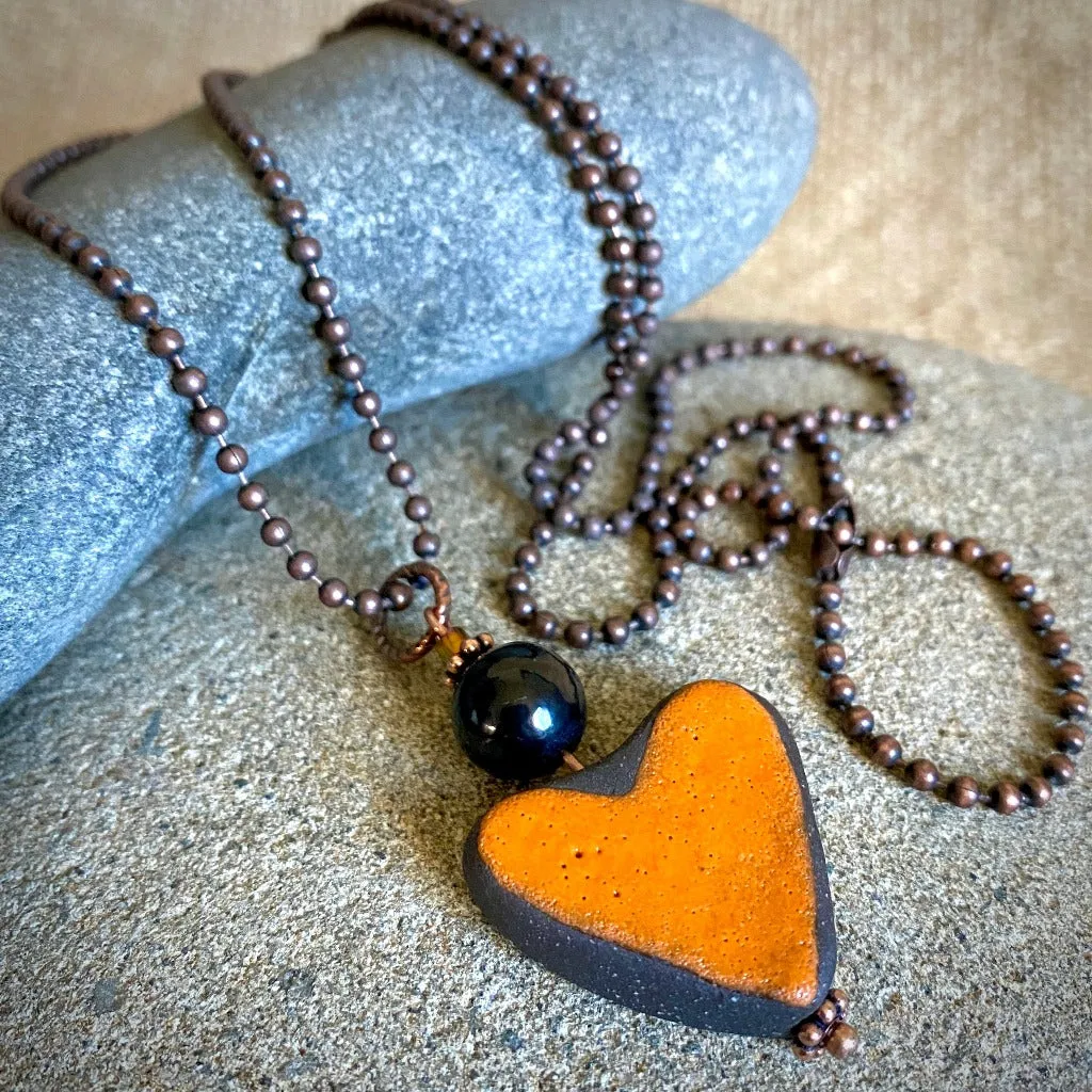 Orange Stoneware Heart Pendant with Shungite Bead on Copper Ball Chain