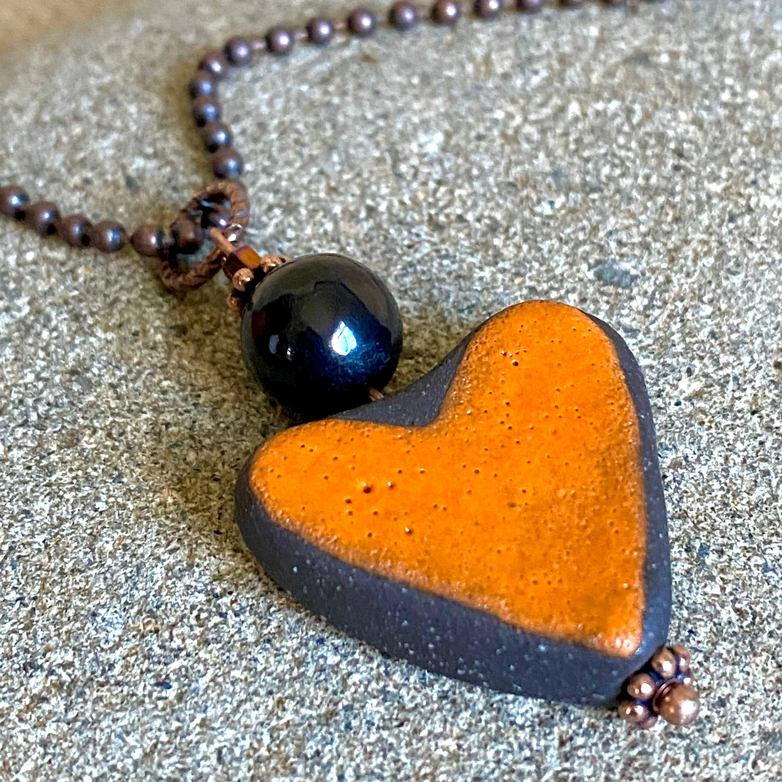 Orange Stoneware Heart Pendant with Shungite Bead on Copper Ball Chain