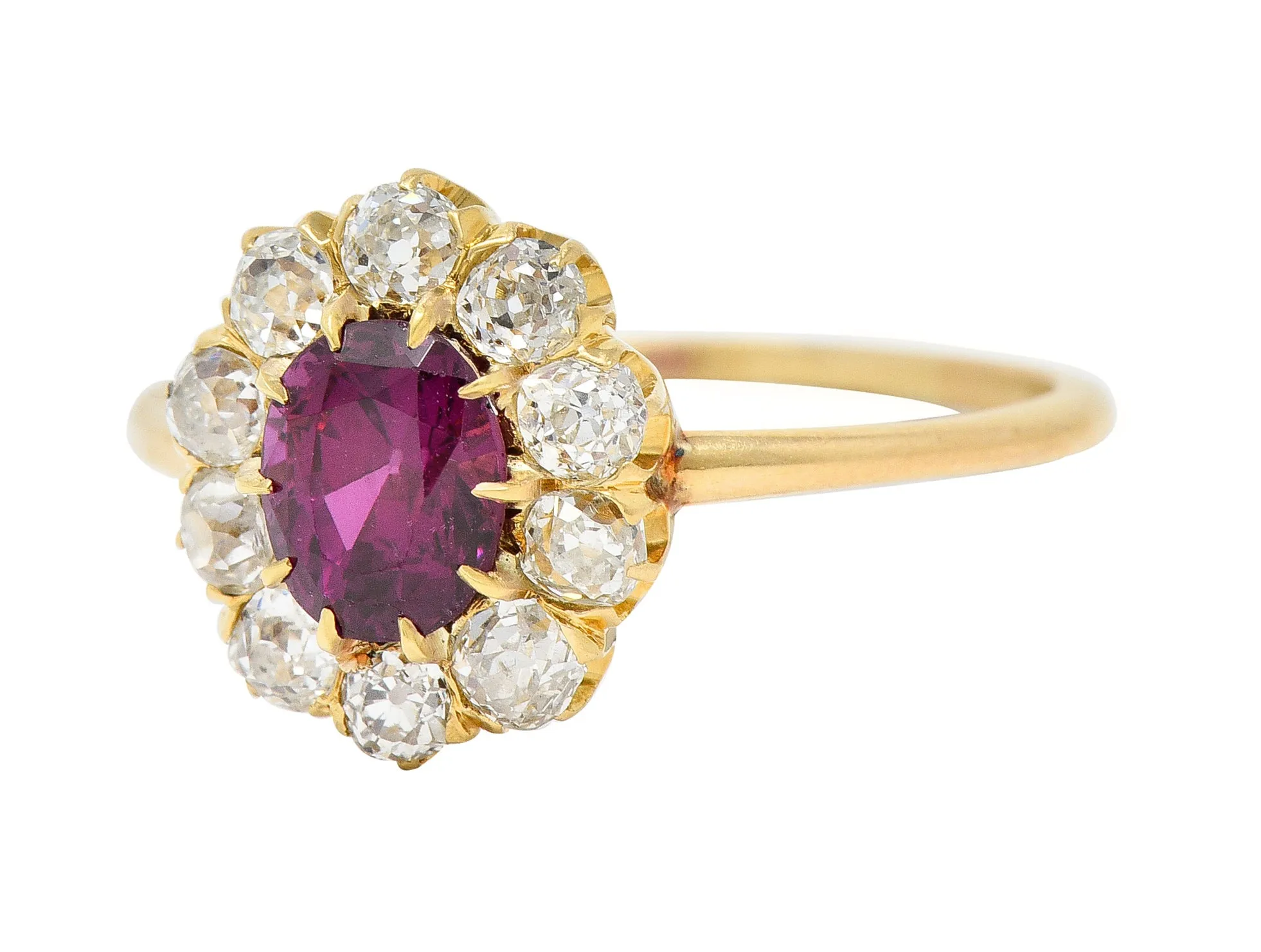 Victorian 1.82 CTW Oval Cut Ruby Old Mine Cut Diamond 14 Karat Yellow Gold Antique Cluster Ring